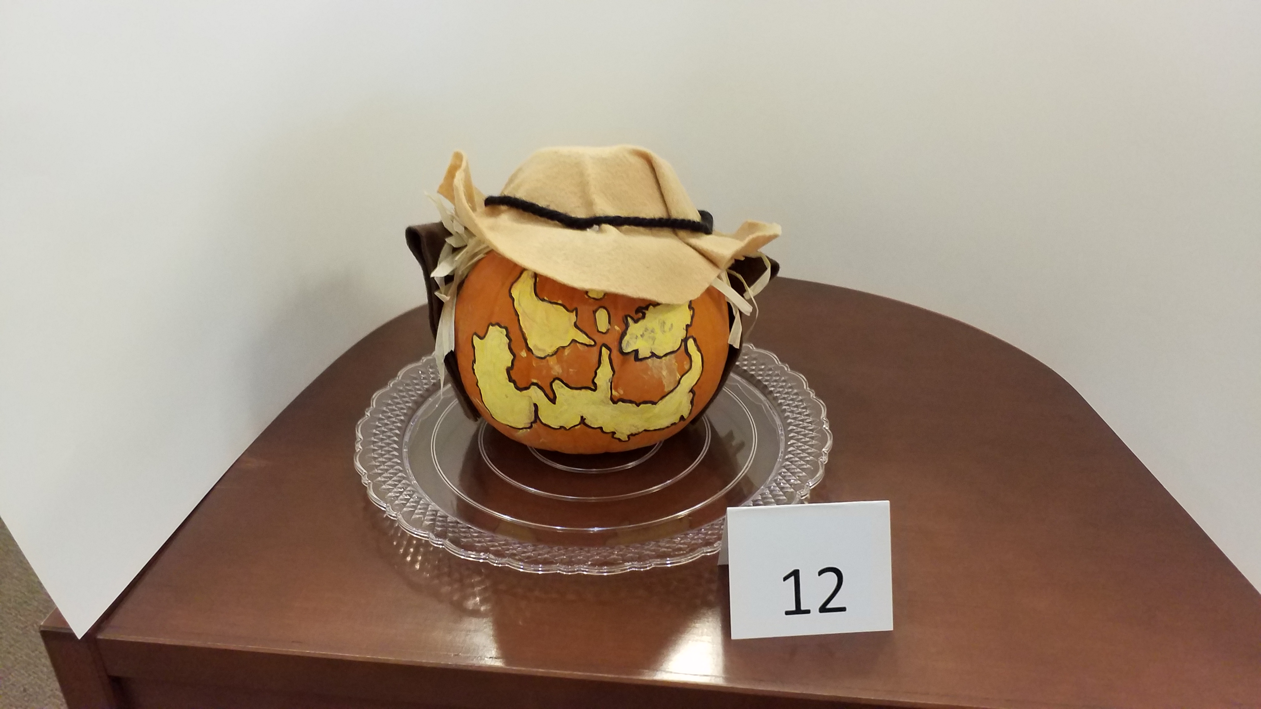 Pumpkin decorated as scarecrow
