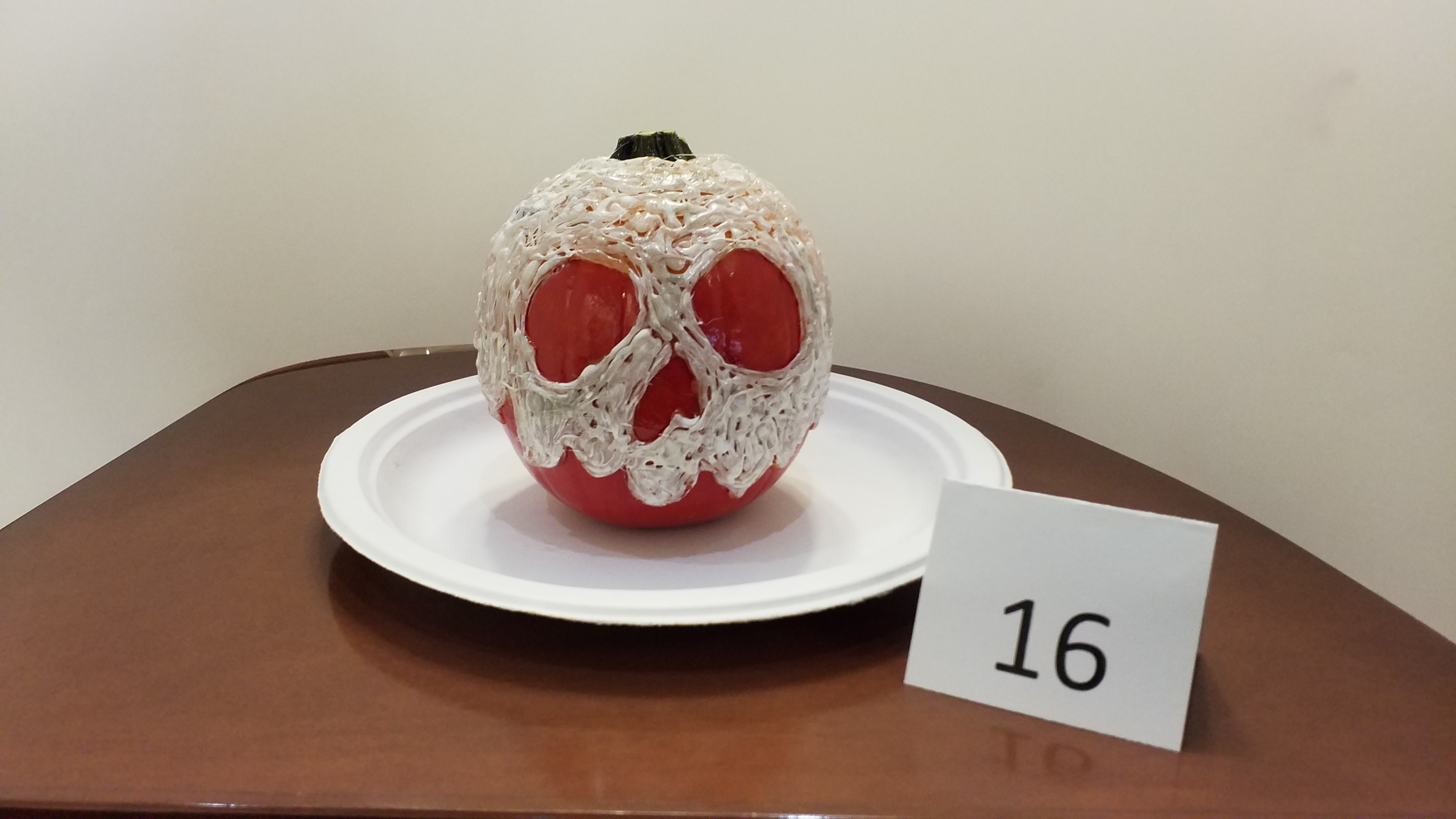 Pumpkin decorated as skull